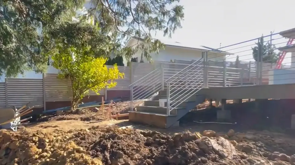 Backyard covered in dirt and debris before excavation